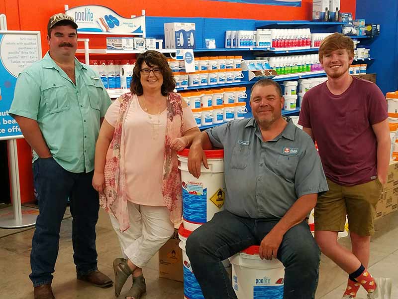 Hutch Pools owners inside the store.