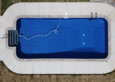 Rectangular pool with a self-cleaning feature.
